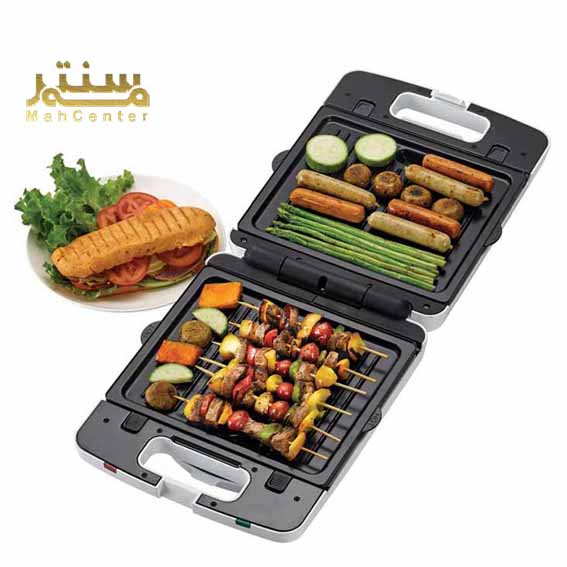 نمای نزدیک از صفحات گریل ساندویچ ساز کنوود SM740 با روکش نچسب و مخزن جمع‌آوری چربی.