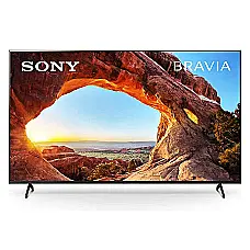 تصویر تلویزیون Sony Bravia با نمایش یک منظره زیبا از طلوع خورشید در پس‌زمینه قوسی طبیعی سنگی.