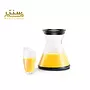 ظرف شیشه‌ای برای آبمیوه با طراحی مدرن و شفاف، همراه با لیوانی هماهنگ.