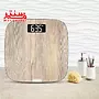 ترازو تفال مدل pp1600 که روی کابیت حمام است و کنار آن جای مایع و استند براش قرار دارد.