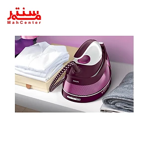 اتو بخار مخزن دار فیلیپس مدل GC7842 کنار لباس